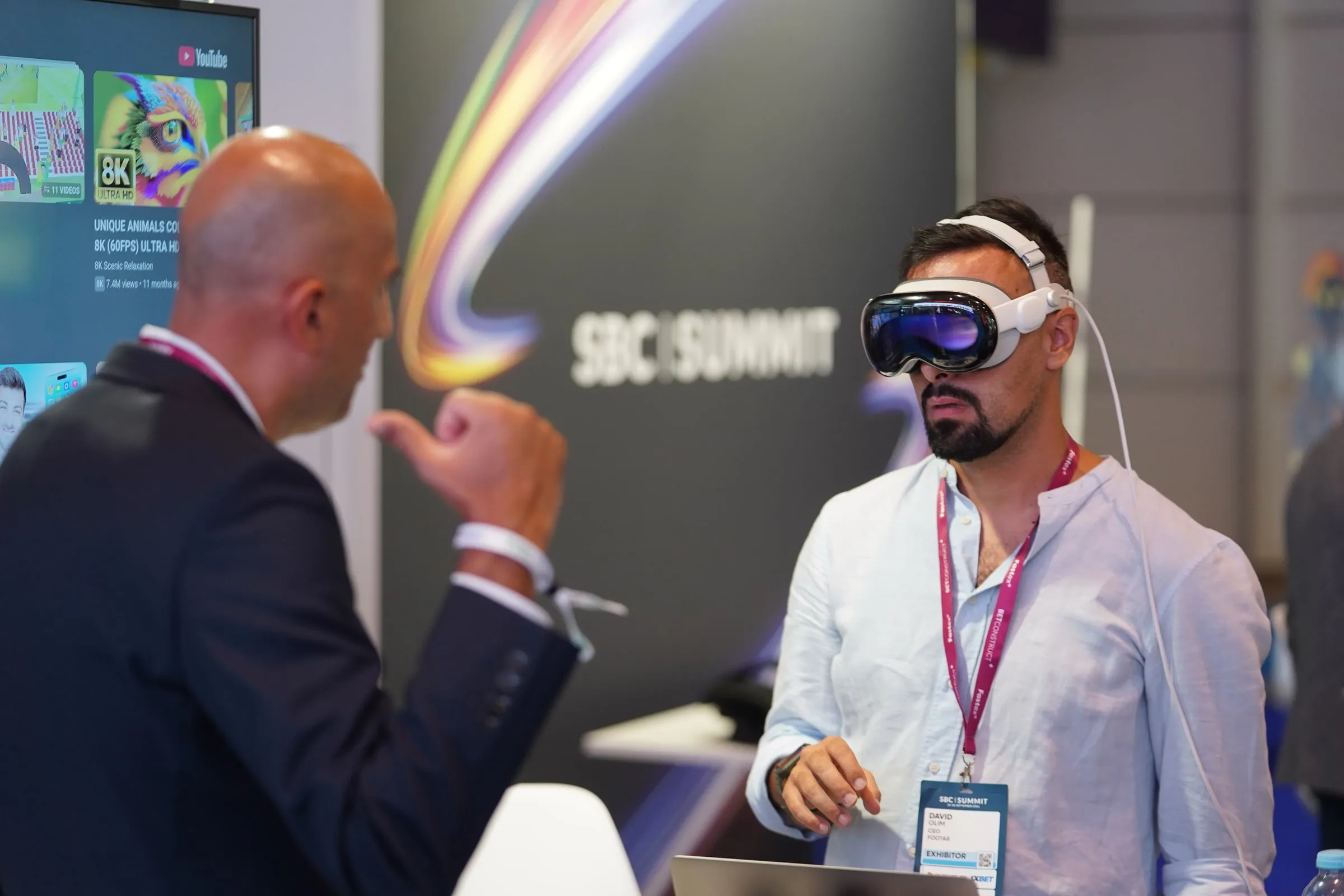 David Olim demonstrating FootAR on Apple Vision Pro to a visitor at SBC Summit 2025
