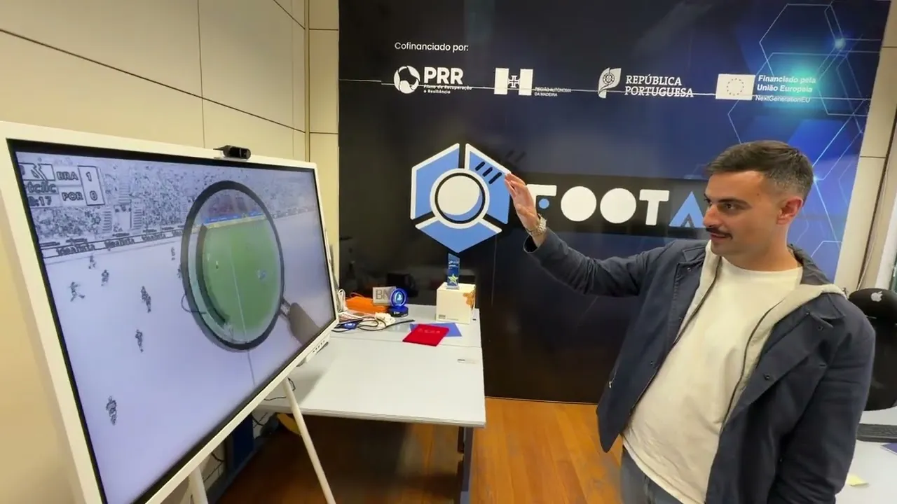 A visitor using Football Scope on a large touchscreen